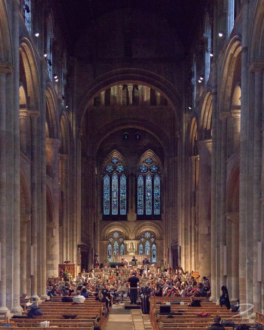 Charity Symphony Orchestra rehearsing in nave of Romsey Abbey