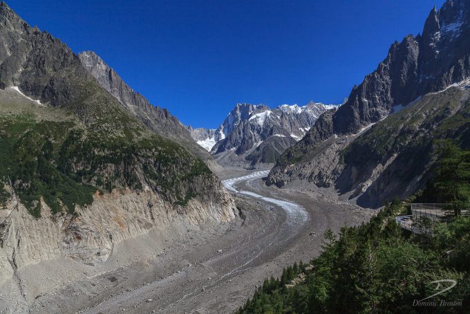 Tail of glacier in steep rocky valley